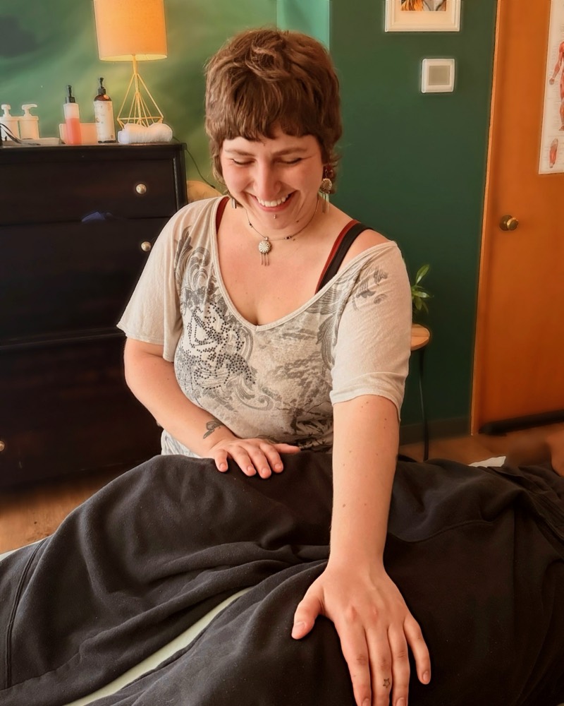 Sabrielle providing supported, draped prenatal massage.